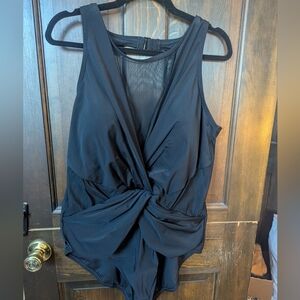 Chic one piece with twist front & mesh detail